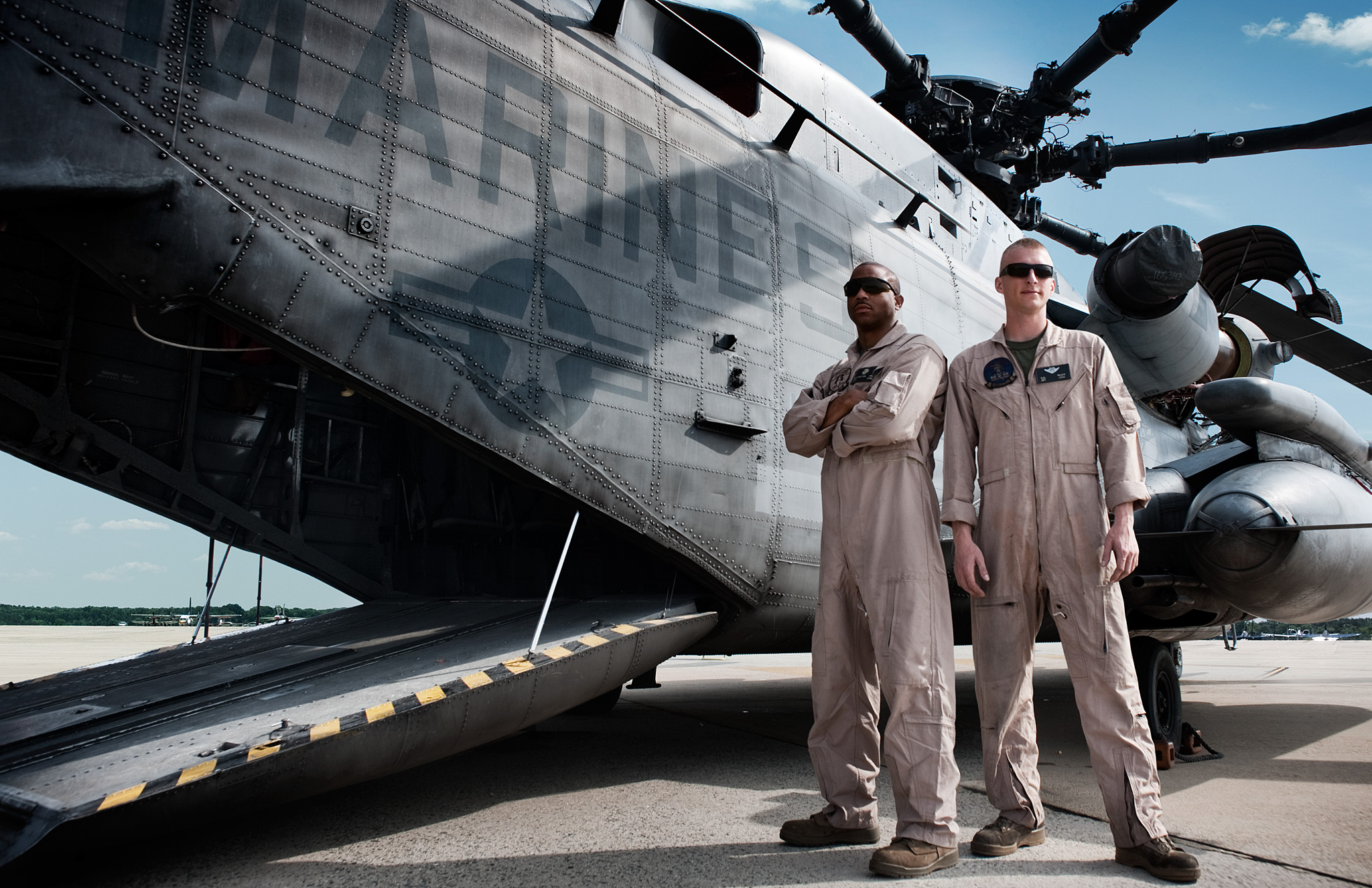 USMC Pilots standing by their CH-53 Helicopter