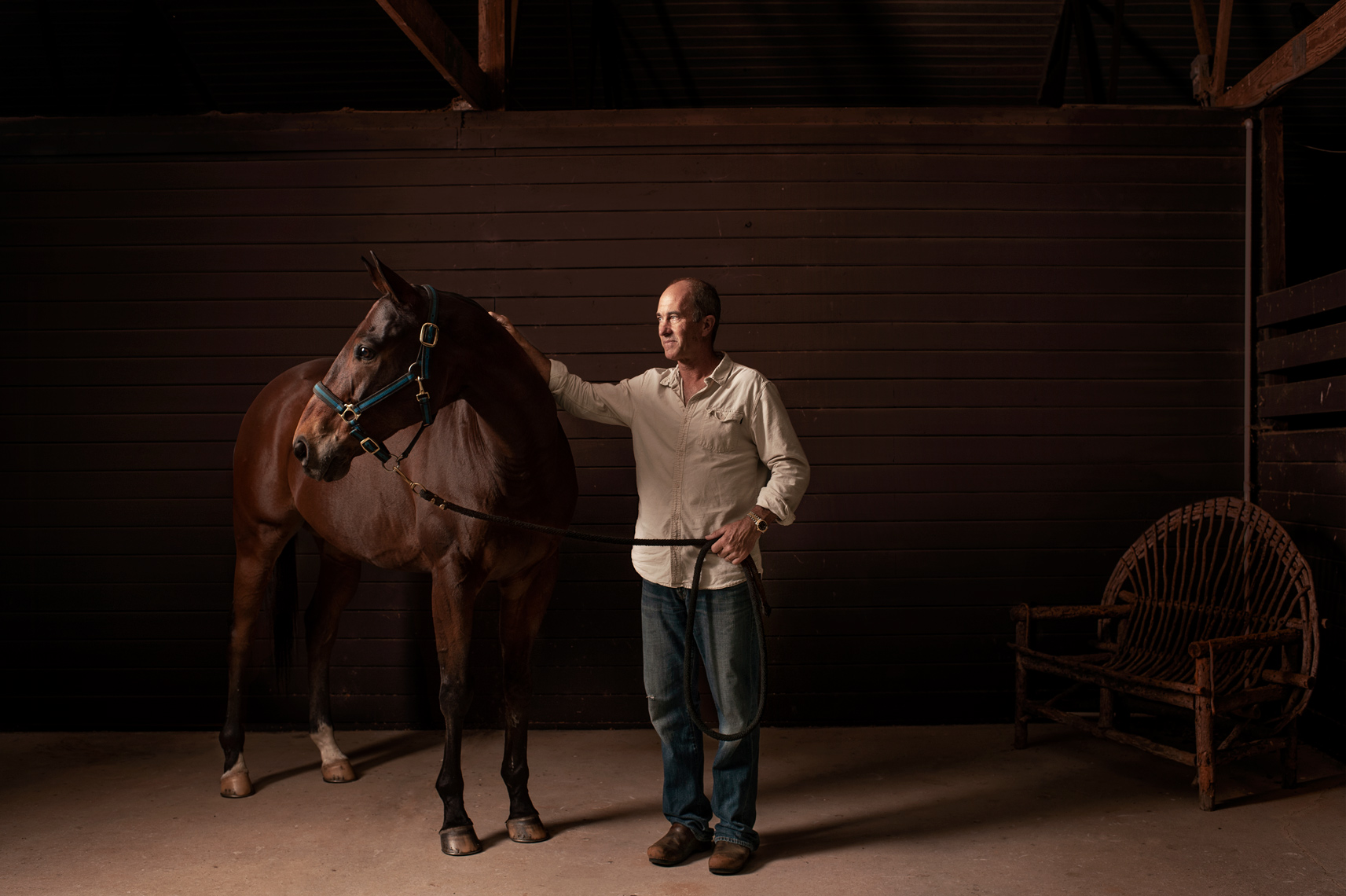 Ten Goal American Polo player Adam Snow & one of his prize polo ponies stand for a portrait